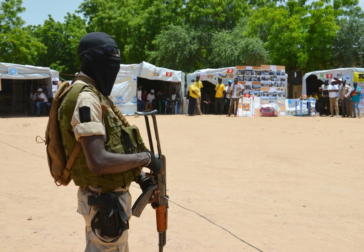  A soldier stands guard near information stands in a camp in Diffa, Niger. File photo / AFP