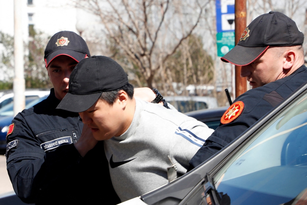 South Korean cryptocurrency entrepreneur co-founder of Terraform Labs (Terra Luna), Do Kwon (C) is taken to court after being arrested at the airport on March 24, 2023 in Podgorica.