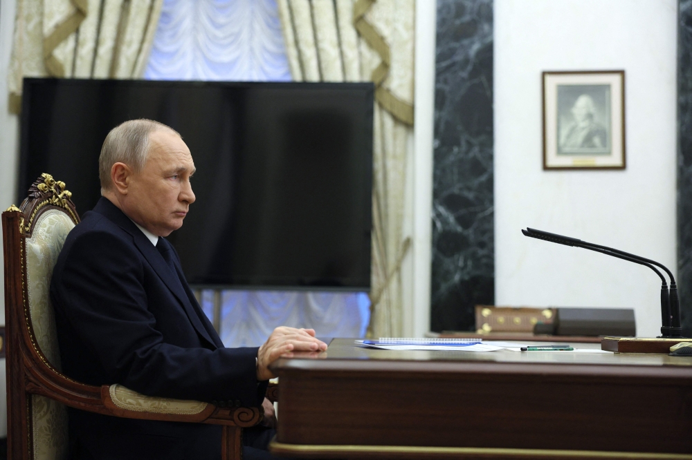 Russian President Vladimir Putin attends a meeting with Transport Minister at the Kremlin in Moscow on March 25, 2023. (Photo by Gavriil GRIGOROV / SPUTNIK / AFP)