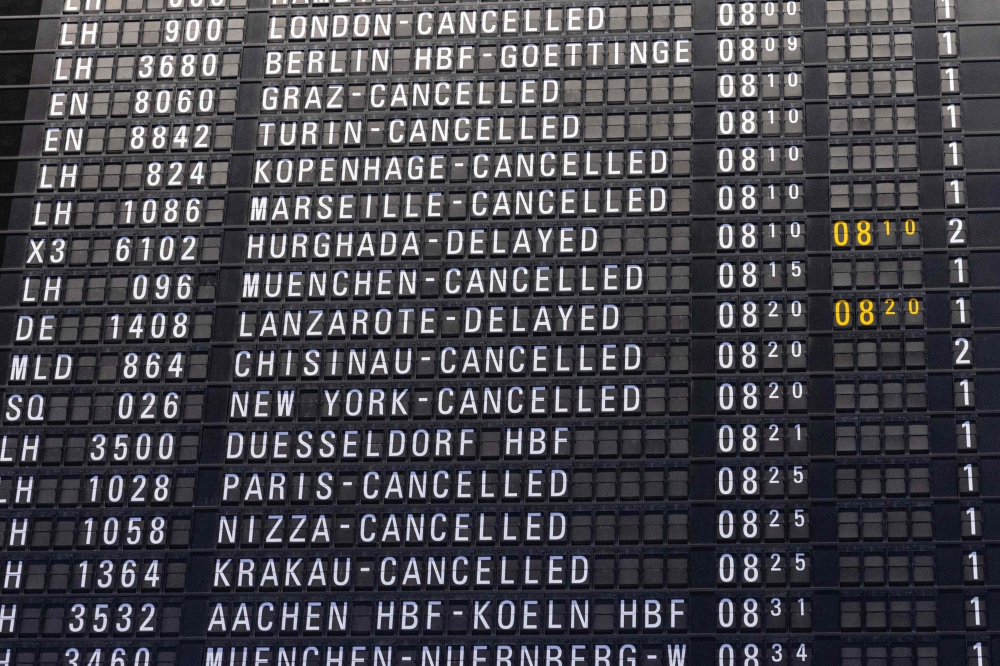 A schedule board displays cancelled and delayed flights during a strike at Frankfurt Airport in Frankfurt am Main, western Germany, on February 17, 2023. Photo by ANDRE PAIN / AFP

