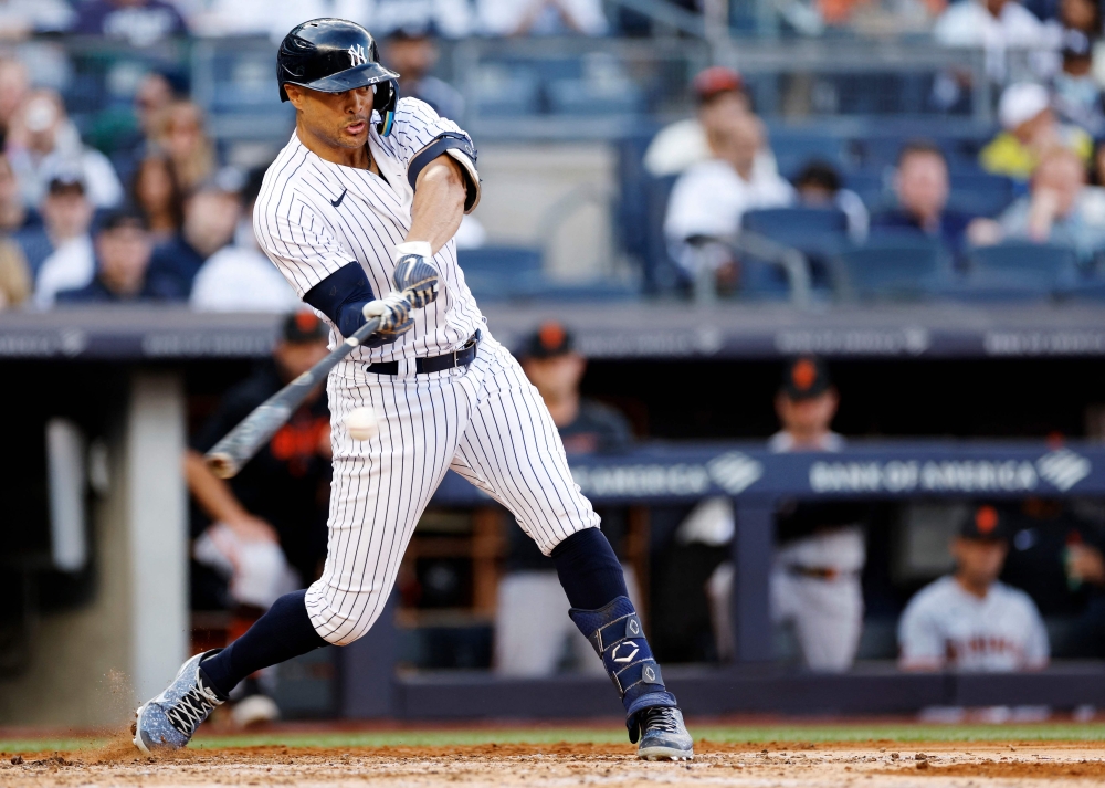 Giancarlo Stanton #27 of the New York Yankees hits a solo home run during the third inning against the San Francisco Giants at Yankee Stadium on April 01, 2023 in the Bronx borough of New York City. (Photo by Sarah Stier / GETTY IMAGES NORTH AMERICA / Getty Images via AFP)