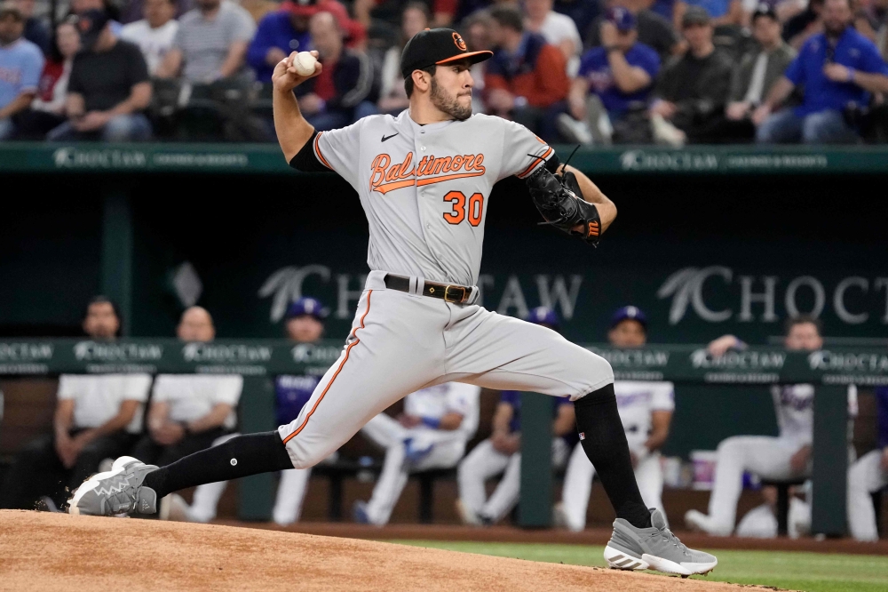 Grayson Rodriguez #30 of the Baltimore Orioles throws a pitch during the first inning of his Major League debut against the Texas Rangers at Globe Life Field on April 05, 2023 in Arlington, Texas. (Photo by Sam Hodde / GETTY IMAGES NORTH AMERICA / Getty Images via AFP)