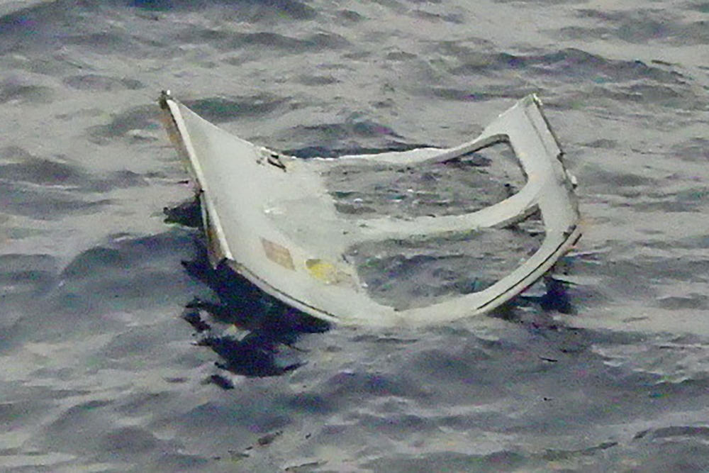 This handout photo taken on April 6, 2023 and received on April 7, 2023 by the 11th Regional Coast Guard Headquarters of the Japan Coast Guard shows flotsam floating on the surface in the search area after a Japan Ground Self-Defense Force (GSDF) military helicopter with 10 people on board disappeared from radar the day before near an island in the southern region of Okinawa. Photo by Handout / Japan Coast Guard / AFP