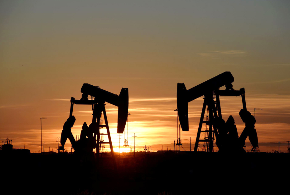Pump jacks operate at sunset in an oil field in Midland, Texas US in this file photo. 