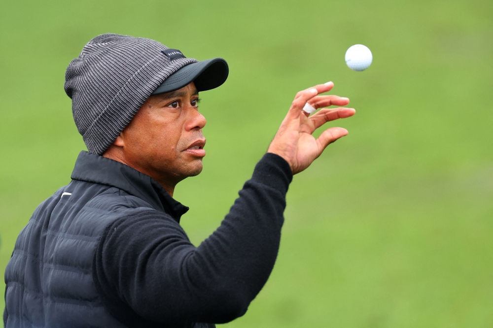 Tiger Woods of the United States catches a ball on the practice area during the third round of the 2023 Masters Tournament at Augusta National Golf Club on April 08, 2023 in Augusta, Georgia. Andrew Redington/Getty Images/AFP 