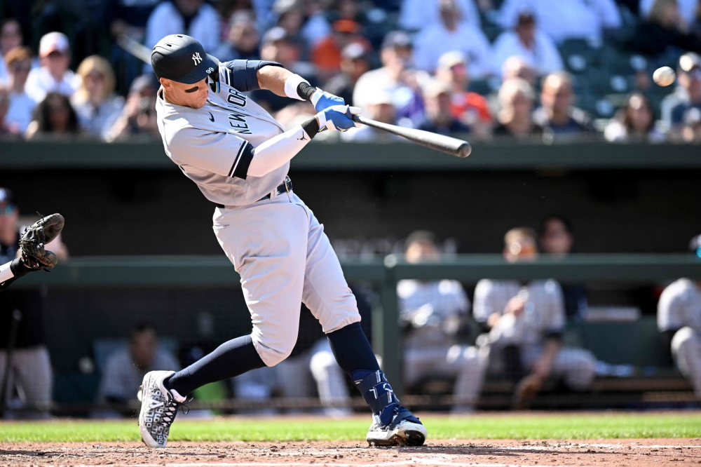 Aaron Judge #99 of the New York Yankees hits a home run in the eighth inning against the Baltimore Orioles at Oriole Park at Camden Yards on April 09, 2023 in Baltimore, Maryland. (Photo by Greg Fiume / GETTY IMAGES NORTH AMERICA / Getty Images via AFP)