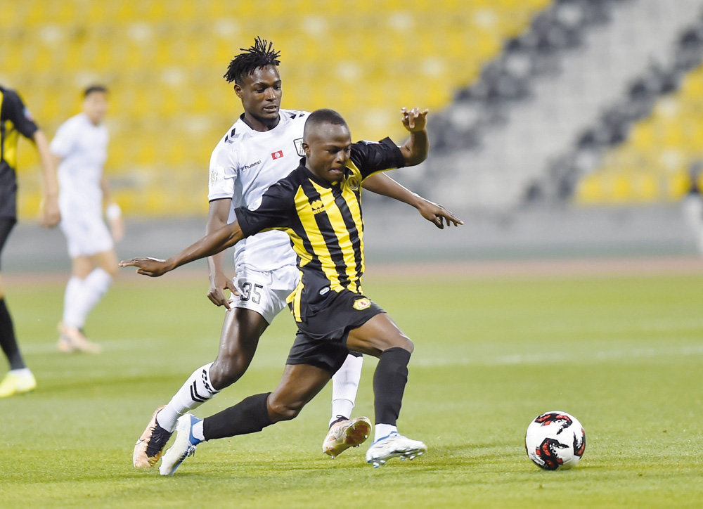 Qatar SC and CS Sfaxien players in action at Suheim Bin Hamad Stadium.  