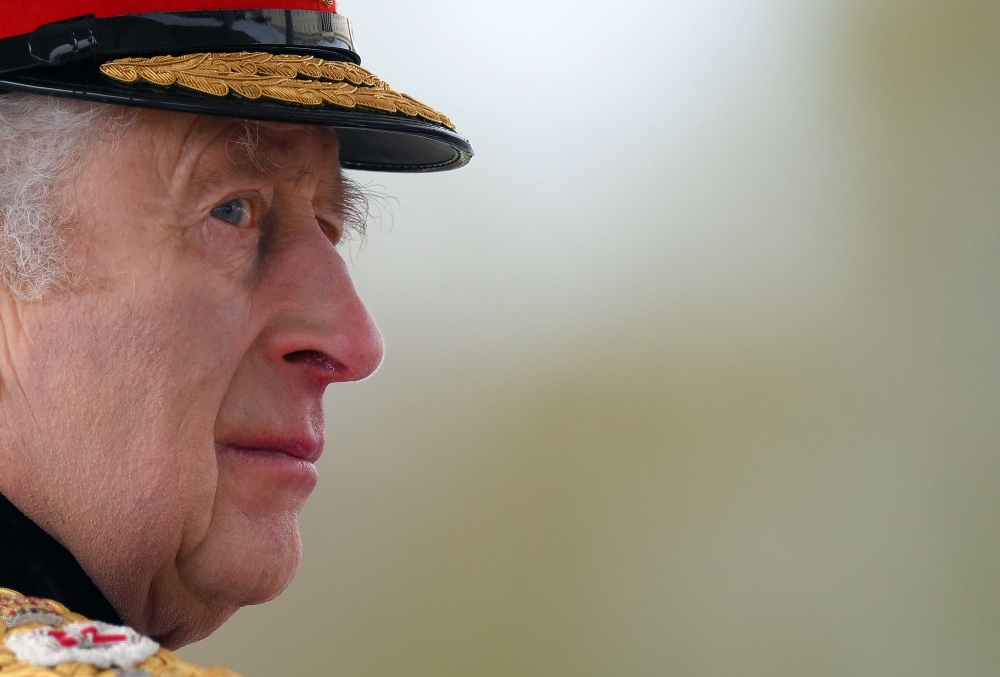 Britain's King Charles III inspects graduating officer cadets march during the 200th Sovereign's Parade at the Royal Military Academy, Sandhurst, southwest of London on April 14, 2023. (Photo by Daniel Leal / AFP)
