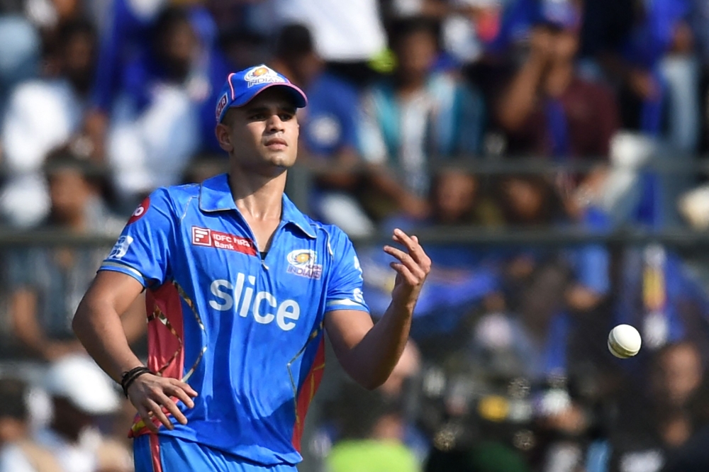 Mumbai Indians' Arjun Tendulkar fields the ball during the Indian Premier League (IPL) Twenty20 cricket match between Kolkata Knight Riders and Mumbai Indians at the Wankhede Stadium in Mumbai on April 16, 2023. (Photo by Punit Paranjpe / AFP)