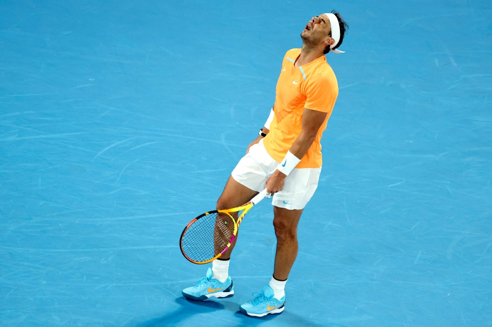 In this file photo taken on January 18, 2023 Spain's Rafael Nadal reacts as he competes against Mackenzie McDonald of the US during his men's singles match on day three of the Australian Open tennis tournament in Melbourne. Photo by Martin KEEP / AFP