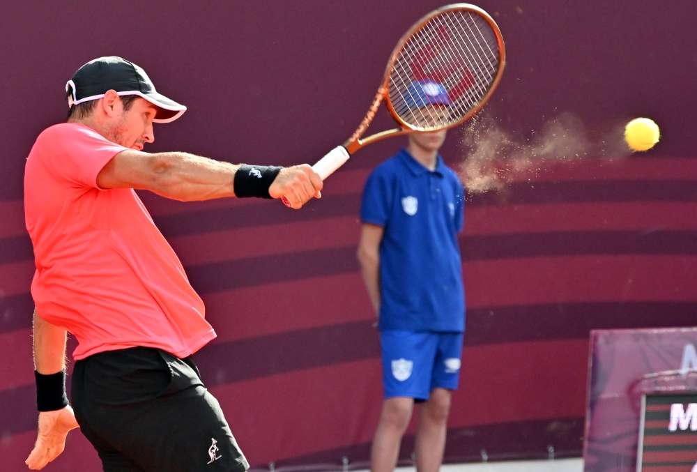 Serbia's Dusan Lajovic plays a righthand return to Serbia's Novak Djokovic during their tennis quarter final singles match at Sprska Tennis Open ATP 250 series tournament in Banja Luka on April 21, 2023. (Photo by ELVIS BARUKCIC / AFP)