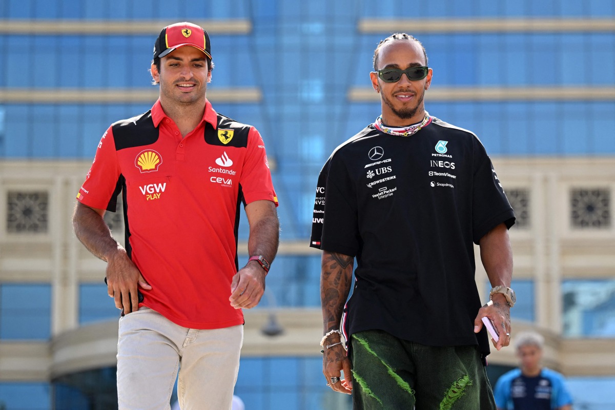 Ferrari’s Carlos Sainz Jr (left) and Mercedes’ Lewis Hamilton walk together after a press conference in Baku, yesterday. AFP 
