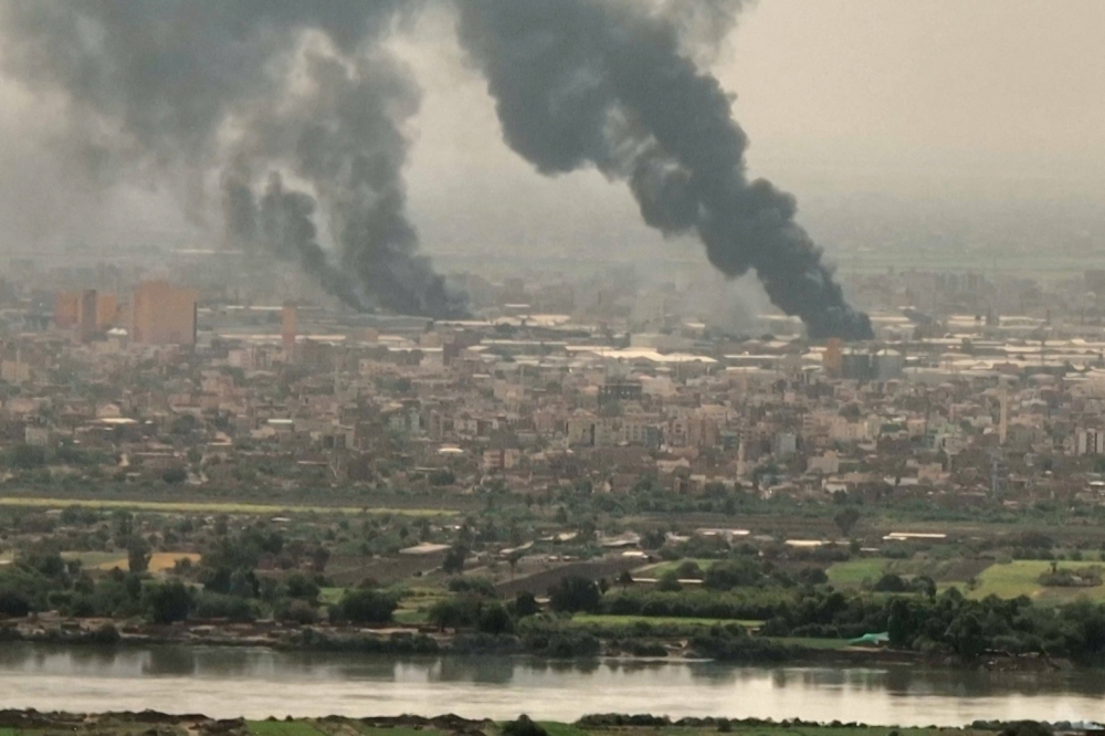 This image grab taken from AFPTV video footage on April 28, 2023, shows an aerial view of black smoke rising over Khartoum. (Photo by AFPTV / AFP)
