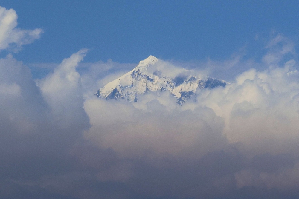 In this file photo taken on March 7, 2023, an aerial picture taken midair from an helicopter shows the summit of Mount Everest, the highest mountain in the world at 8,848 metres, in Nepal's Himalayas range. Photo by Sebastien BERGER / AFP
