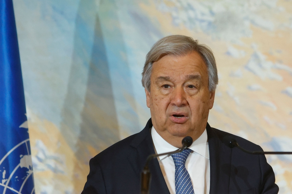 UN chief Antonio Guterres addresses international envoys during talks on Afghanistan in Doha, on May 2, 2023. (Photo by KARIM JAAFAR / AFP)