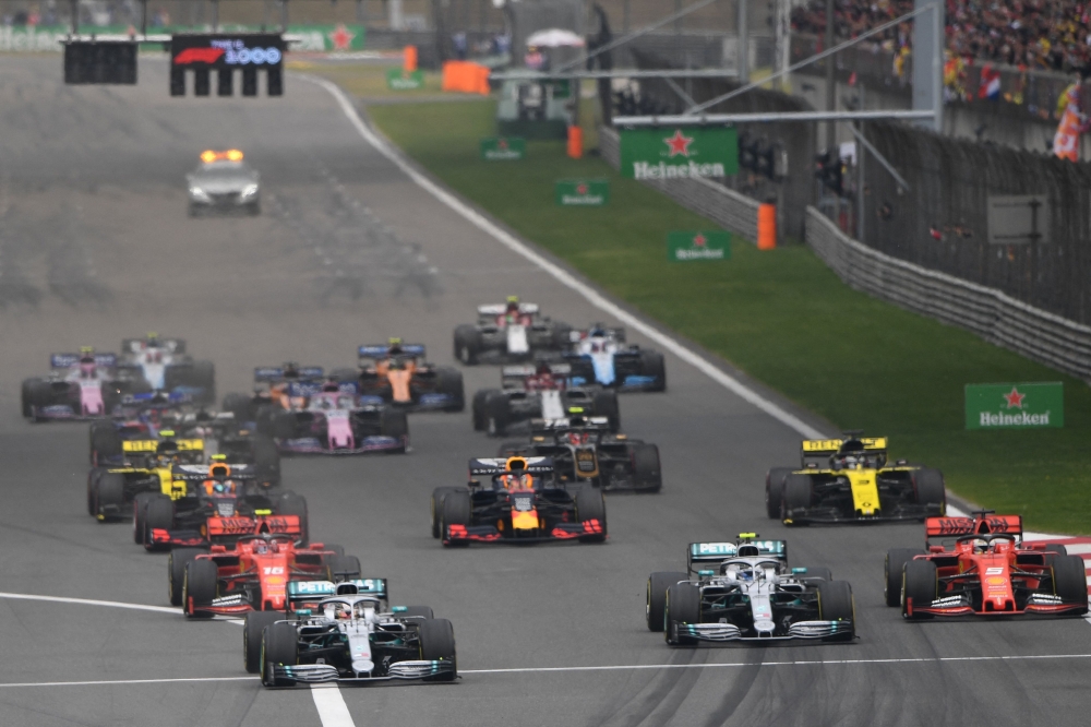 This file photo taken on April 14, 2019 shows drivers setting off at the start of the Formula One Chinese Grand Prix in Shanghai. Photo by Greg Baker / AFP

