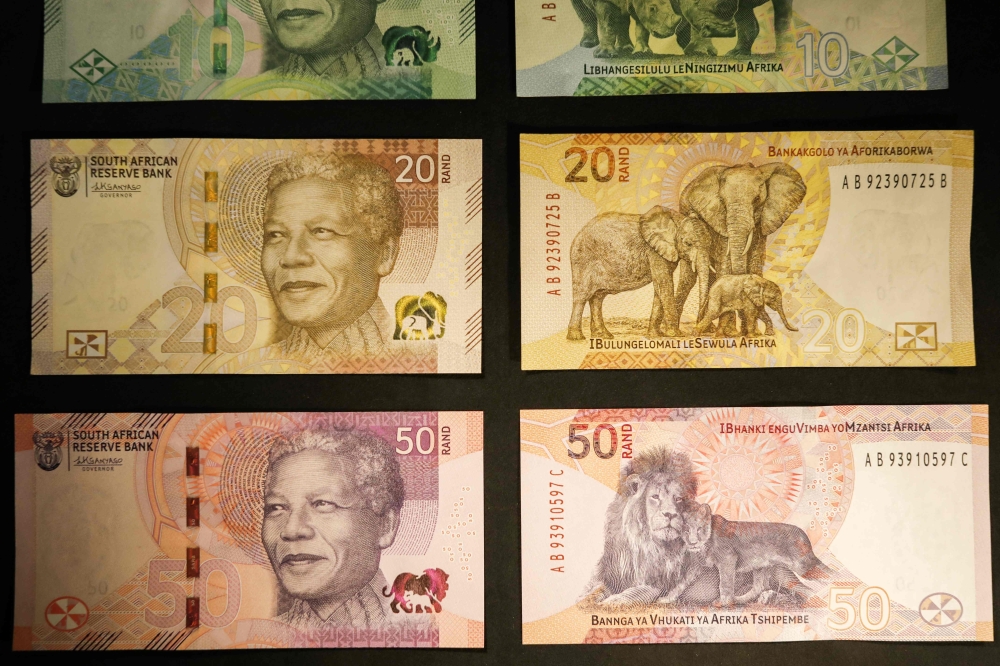 Newly upgraded South African Rand banknotes depicting former South African president Nelson Mandela are displayed at the Nelson Mandela Foundation in Johannesburg on May 4, 2023. (Photo by Phill Magakoe / AFP)