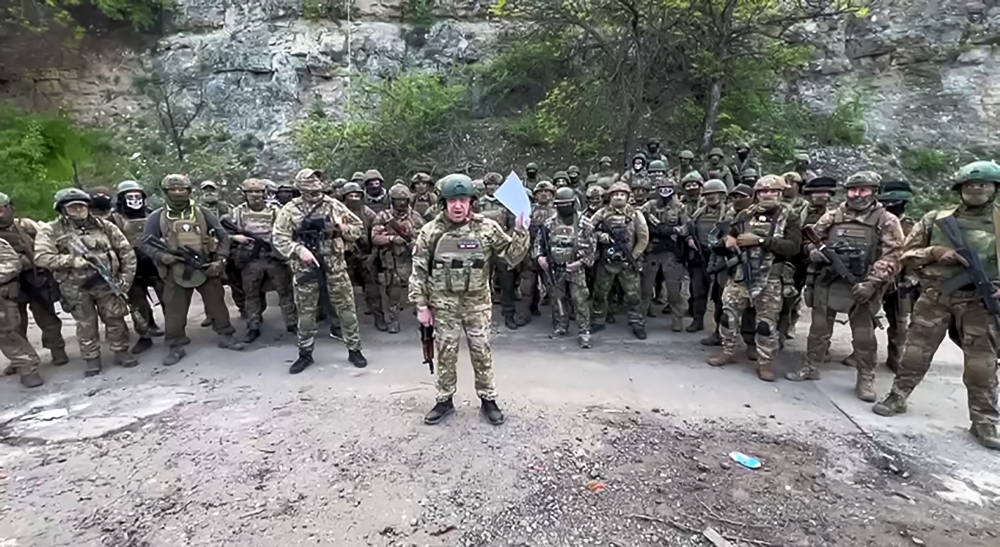 :This video grab taken from a handout footage posted on May 5, 2023 on the Telegram account of the press-service of Concord -- a company linked to the chief of Russian mercenary group Wagner, Yevgeny Prigozhin -- shows Yevgeny Prigozhin addressing the Russian army's top brass standing in front of Wagner fighters at an undisclosed location. (Photo by Handout / TELEGRAM/ @concordgroup_official / AFP)
