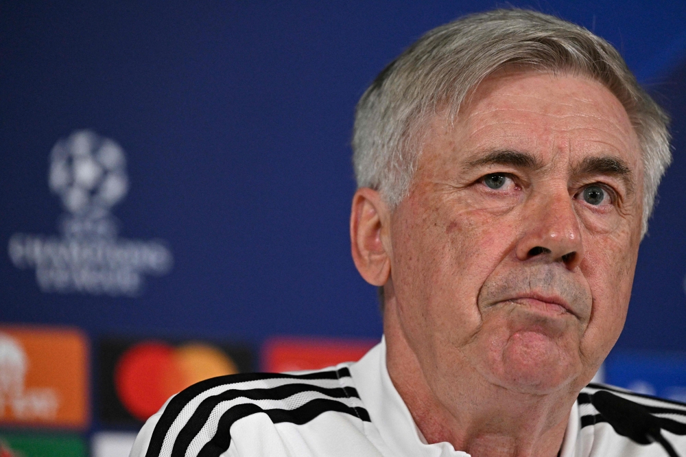 Real Madrid's Italian coach Carlo Ancelotti addresses a press conference of Real Madrid CF on the eve of their UEFA Champions League semi-final first leg football match against Manchester City at Valdebebas Sport City in Madrid on May 8, 2023. (Photo by JAVIER SORIANO / AFP)