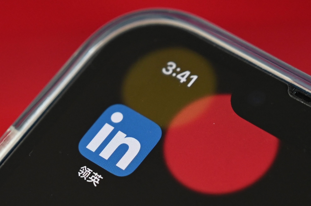 This file photo illustration taken on October 15, 2021 shows the LinkedIn China application on a mobile phone in Beijing. Photo by GREG BAKER / AFP