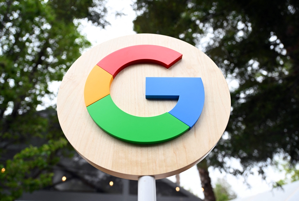 The Google logo is seen during the Google I/O annual developers conference at Shoreline Amphitheatre in Mountain View, California on May 10, 2023. (Photo by Josh Edelson / AFP)