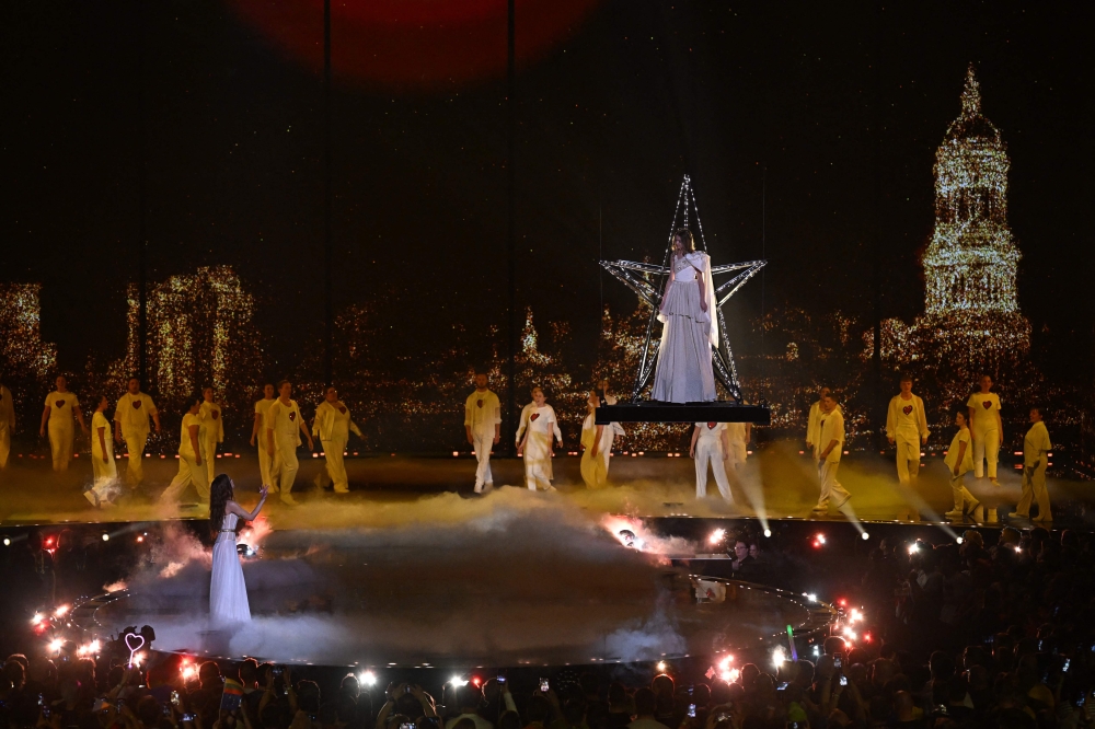 Ukrainian singer Mariya Yaremchuk (left) performs during a break in the second semi-final of the Eurovision Song contest 2023 at the M&S Bank Arena in Liverpool, northern England on May 11, 2023. (Photo by Paul Ellis / AFP)
