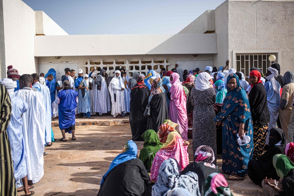 Voters wait to vote at a polling station in Nouakchott on May 13, 2023. Photo by MED LEMINE RAJEL / AFP
