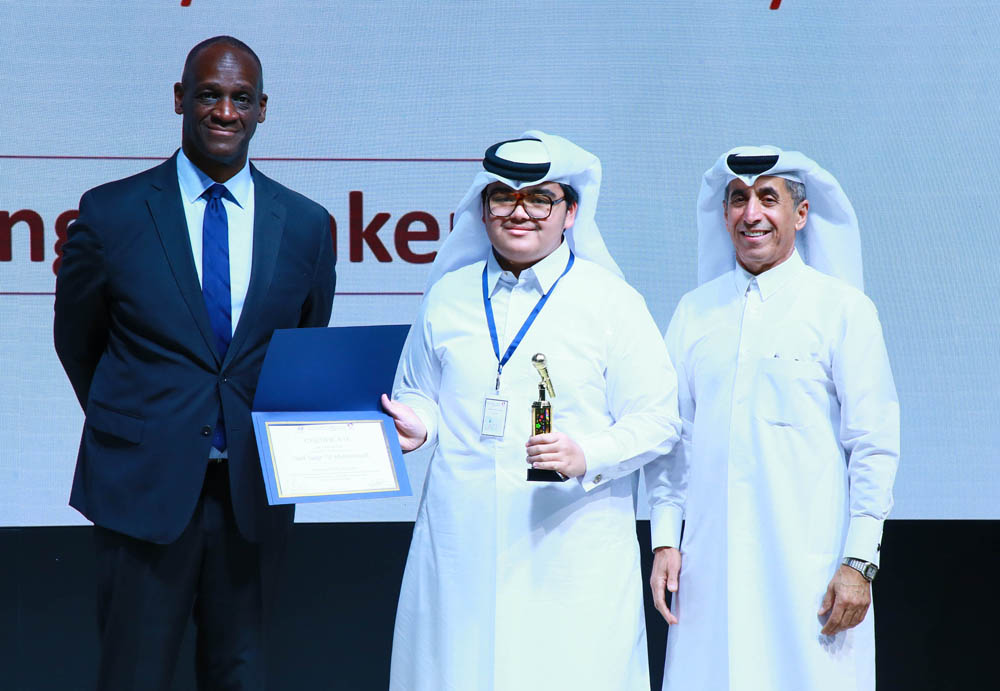 Undersecretary of the Ministry of Education and Higher Education Dr. Ibrahim bin Saleh Al Nuaimi and US Ambassador to Qatar H E Timmy T. Davis honouring a winner first student community outreach competition for English public speaking.