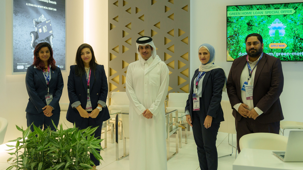 Officials at the Doha Bank stand at Build Your House Exhibition 2023.