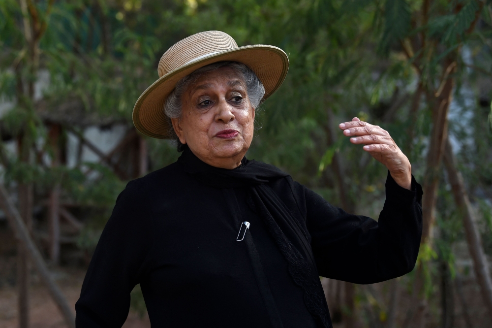 In this picture taken on May 4, 2023, architect Yasmeen Lari, the head of Heritage Foundation of Pakistan, speaks during an interview with AFP at her garden in Karachi. (Photo by Asif Hassan / AFP)