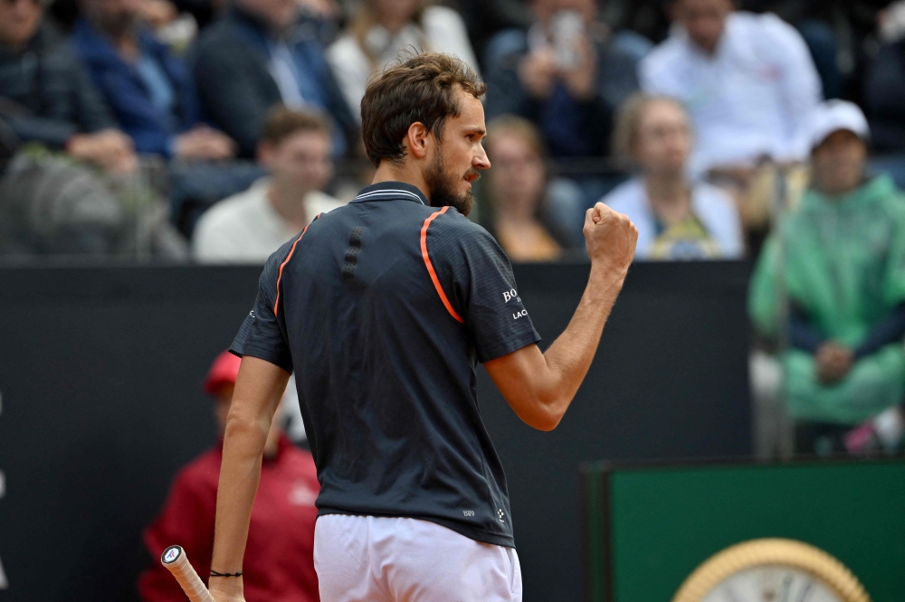 Russia's Daniil Medvedev reacts after winning a point against Denmark's Holger Rune during the final of the Men's ATP Rome Open tennis tournament on the central court of Foro Italico in Rome on May 21, 2023. (Photo by Tiziana FABI / AFP)