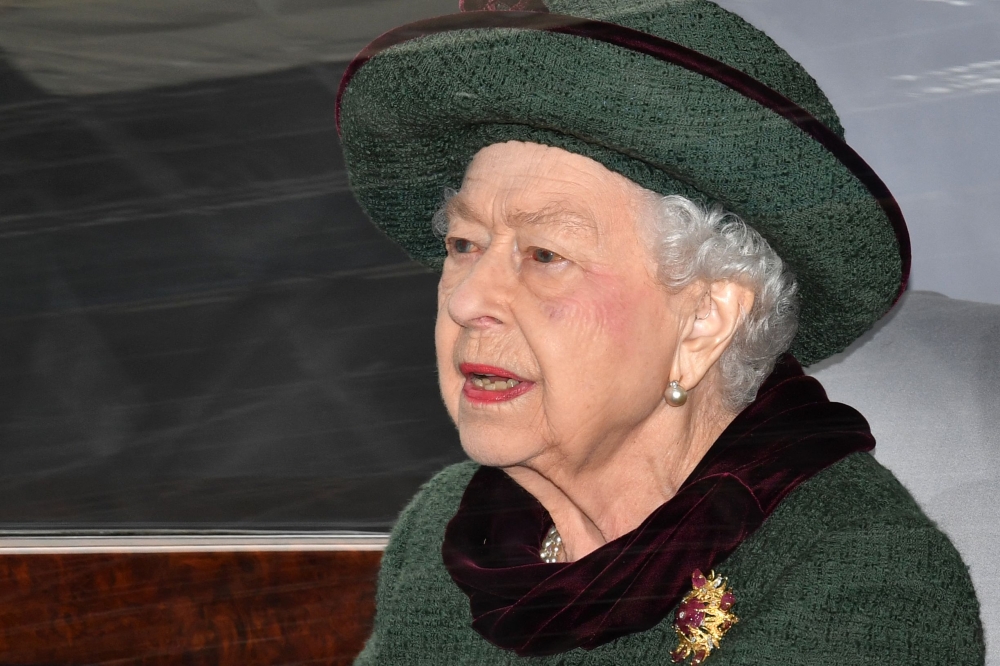 In this file photo taken on March 29, 2022 Britain's Queen Elizabeth II leaves after attending a Service of Thanksgiving for Britain's Prince Philip, Duke of Edinburgh, at Westminster Abbey in central London.  (Photo by Justin Tallis / AFP)