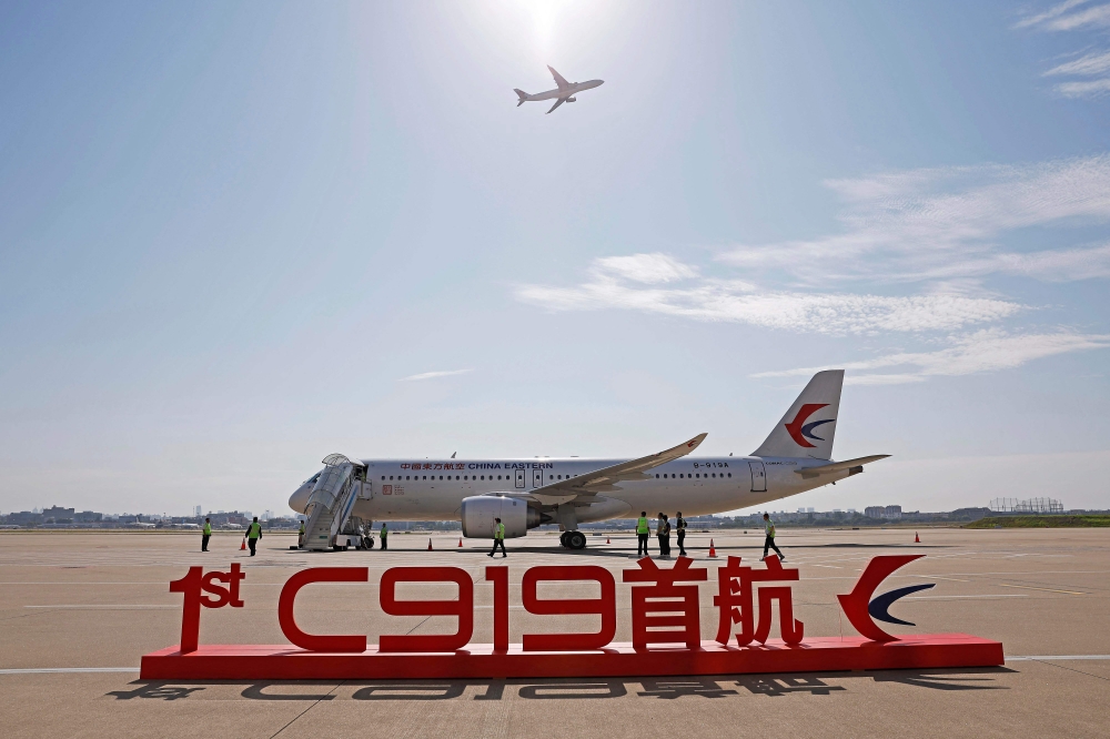 China's first domestically produced passenger jet C919 is seen before its first commercial flight from Shanghai to Beijing, at Shanghai Hongqiao Airport on May 28, 2023. (Photo by AFP) 