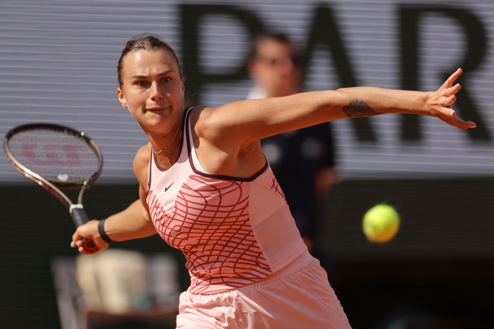 Belarus' Aryna Sabalenka plays a forehand return to Ukraine's Marta Kostyuk during their women's singles match on day one of the Roland-Garros Open tennis tournament at the Court Philippe-Chatrier in Paris on May 28, 2023. Photo by Thomas SAMSON / AFP