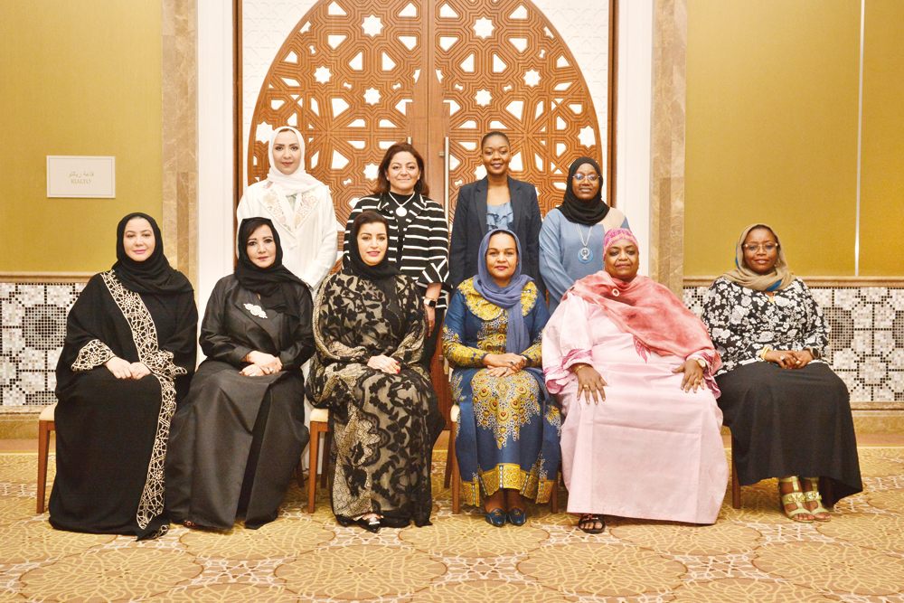 The First Lady of Zanzibar, H E Mariam Mwinyi, QBWA Vice Chairman, Aisha Al Fardan pose for a group photo with other officials during the meeting.