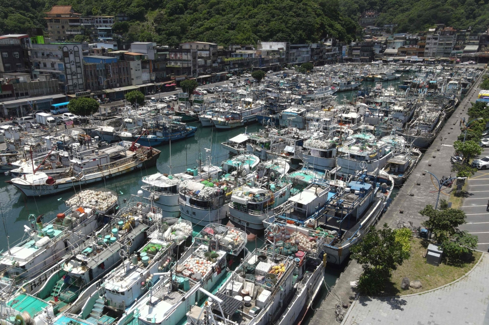 Fishing boats are docked in the Nanfangao Fishing Harbour for shelters in Yilan county as typhoon Mawar approaches on east coast of Taiwan on May 29, 2023. (Photo by Sam Yeh / AFP)