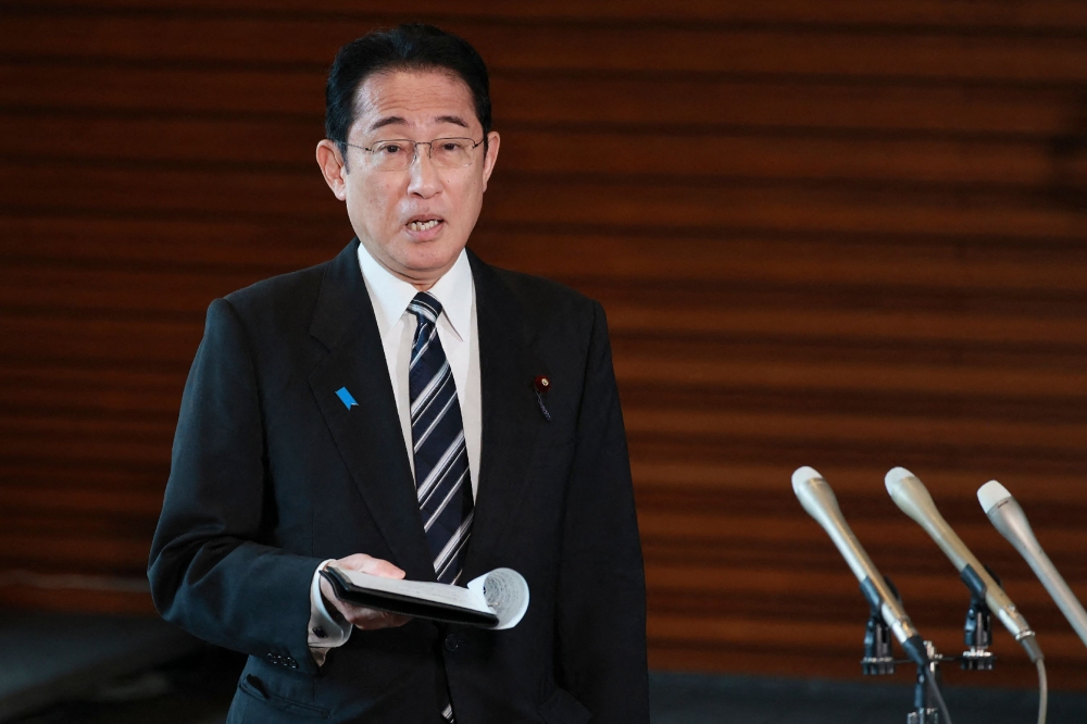 Japan's Prime Minister Fumio Kishida answers questions from reporters after North Korea announced it would launch a satellite, at the prime minister's office in Tokyo on May 29, 2023. (Photo by JIJI Press / AFP) 
 