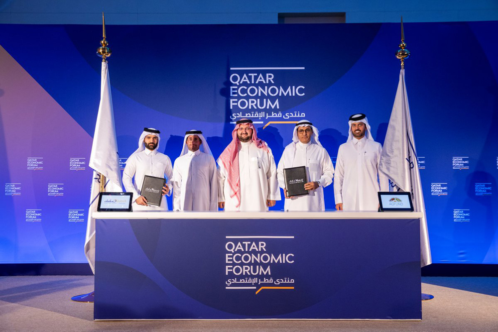 Officials at the signing of the agreement at Qatar Economic Forum. 