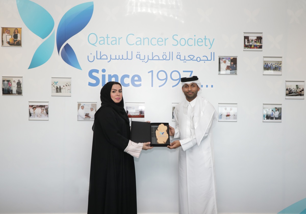 Nasser Al Sharshani, General Manager of Uber Qatar (right) with Mona Ashkanani - Director General of Qatar Cancer Society.