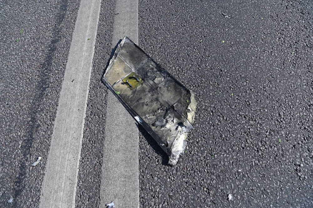 This handout picture posted on June 1, 2023 on the official Telegram account of Vyacheslav Gladkov, governor of the Belgorod region, shows what is presented as a part of an unmanned aerial vehicle (drone) on a street in the region capital of Belgorod. Photo by Handout / TELEGRAM / VVGLADKOV / AFP