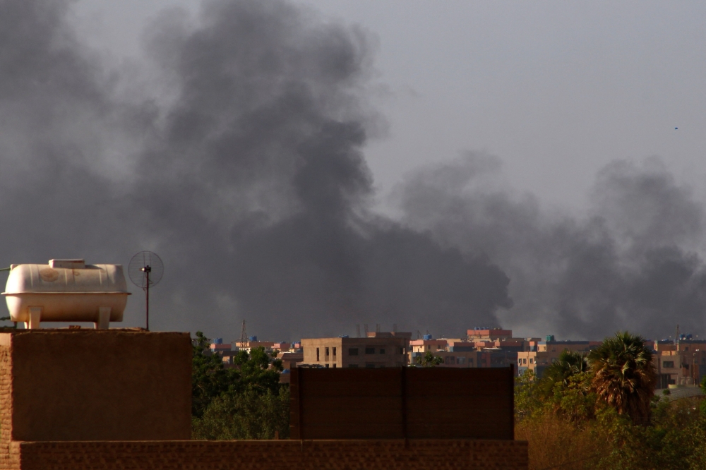 Smoke billows over south Khartoum after more than a month of deadly fighting between forces loyal to two rival generals. (File photo by AFP)