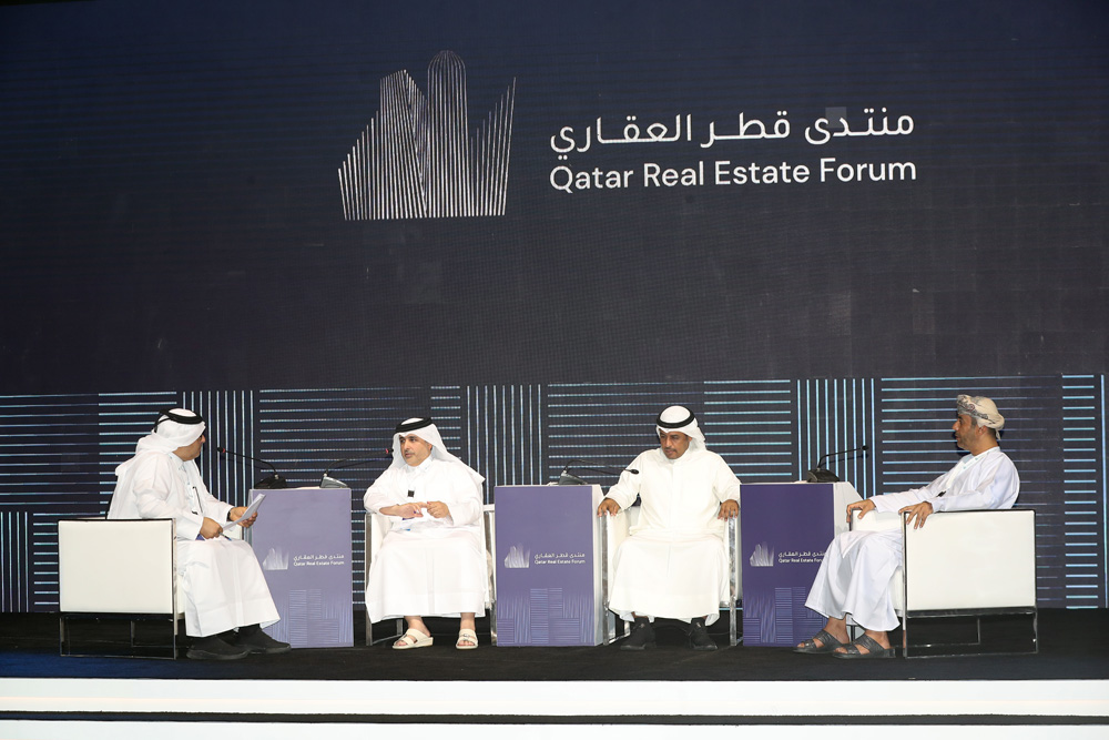 Minister of Municipality H E Dr. Abdullah bin Abdulaziz bin Turki Al Subaie (second left); Kuwait's Minister of Electricity, Water and Renewable Energy and Minister of State for Housing H E Mutlaq Naief Omar Abu Raqaba Al Otaibi (second right); Undersecretary of Oman’s Ministry of Housing and Urban Planning for Housing H E Eng Hamad Ali Sulaiman Al Nazwani (first right) and moderator Mohamed Al Marri during a panel discussion at the First Qatar Real Estate Forum, in Doha, yesterday. 