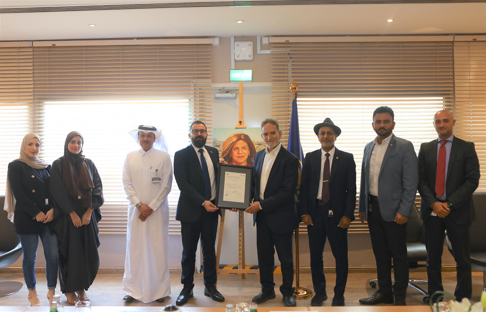 Al Jazeera officials receiving the ISO certification. 