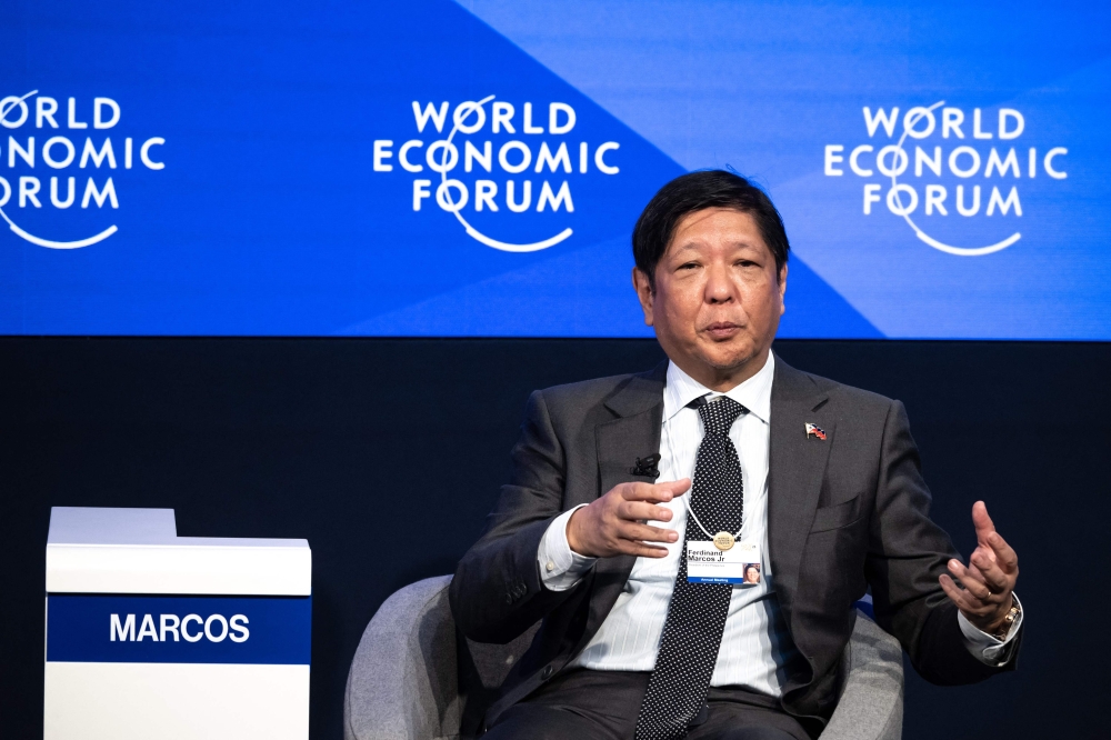Philippine President Ferdinand Marcos Jr speaks at a session during the World Economic Forum annual meeting in Davos on January 18, 2023. (Photo by Fabrice Coffrini / AFP)