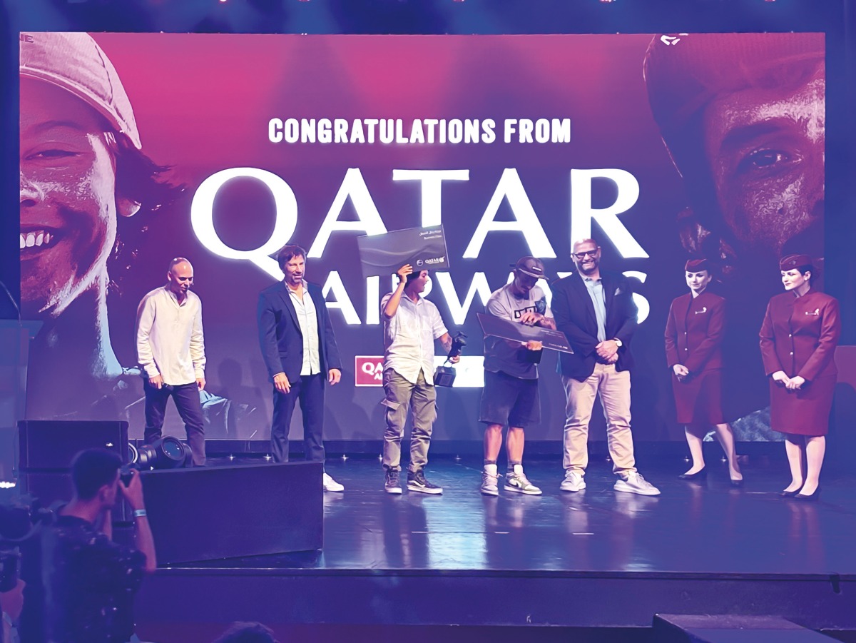 Winners with officials and Qatar Airways cabin crew.