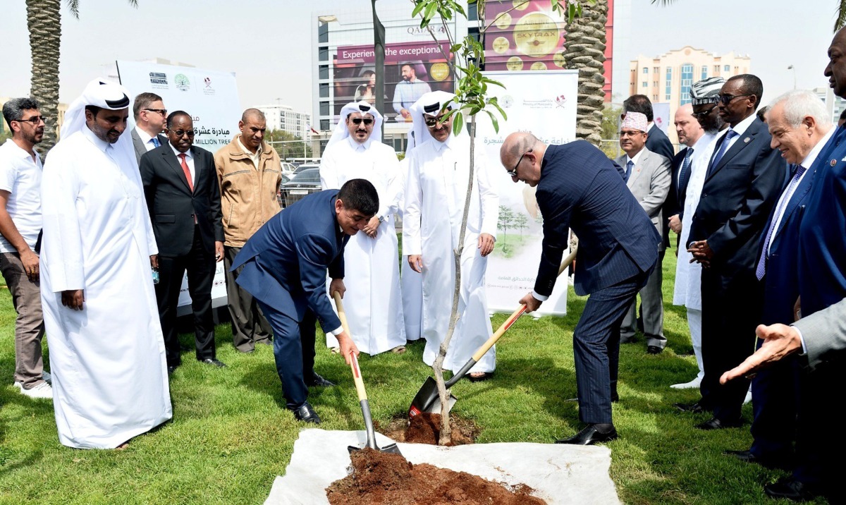 Ambassadors and officials of Public Parks Department during a tree plantation event at Al Gharrafa Park. 