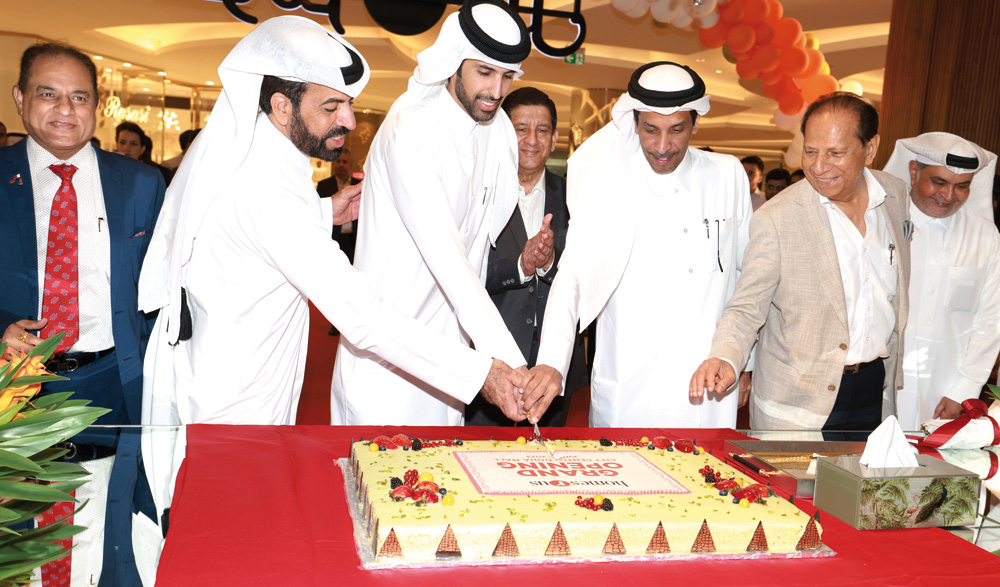 Homes r Us officials during the grand opening of newest store recently.