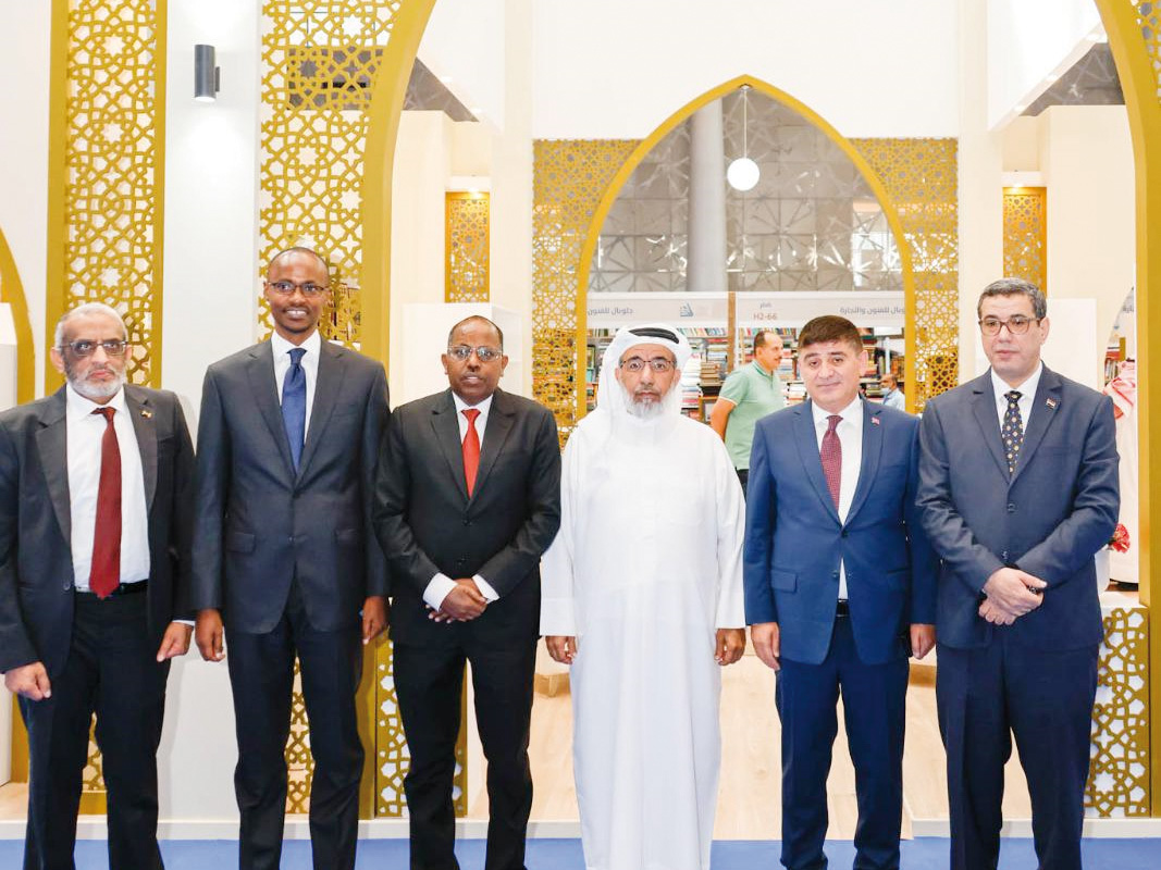 Minister of Awqaf and Islamic Affairs H E Ghanem bin Shaheen bin Ghanem Al Ghanem (third right) during his visit to the Ministry’s pavilion at the 32nd Doha International Book Fair yesterday.