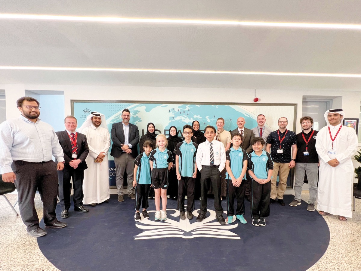 Officials and students from Nord Anglia International School Al Khor, Ras Laffan Industrial City Community Outreach Programme and local tech company Gamyra.