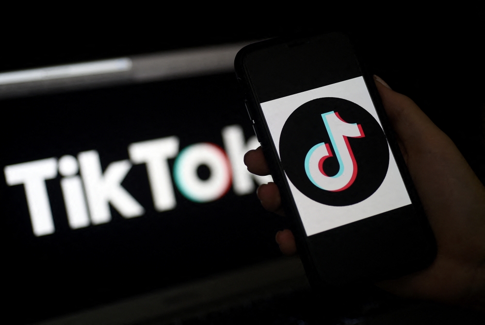 In this file photo taken on April 13, 2020 the social media application logo, TikTok is displayed on the screen of an iPhone in Arlington, Virginia. Photo by Olivier DOULIERY / AFP